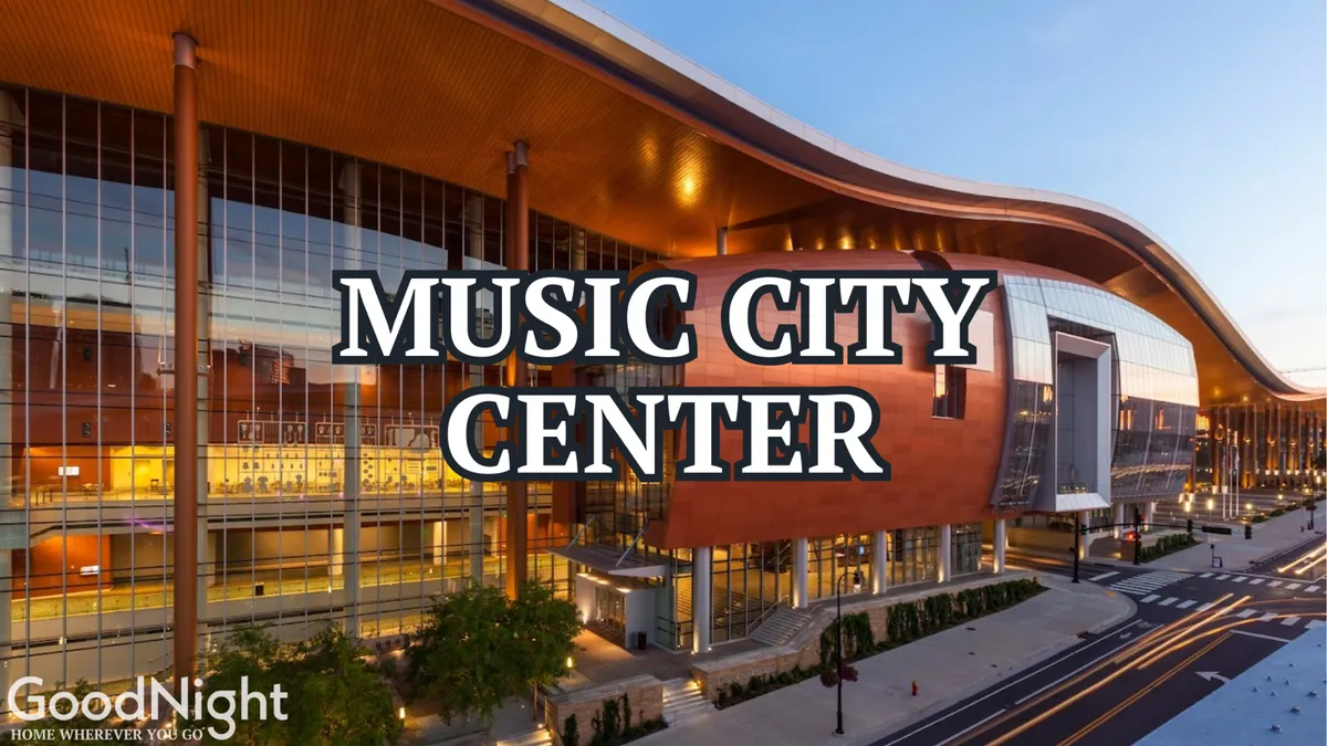 A clear exterior shot of the Music City Center building, surrounded by lush greenery and a bustling street view. The impressive modern architecture stands out, inviting visitors to enjoy concerts, exhibitions, and community events.